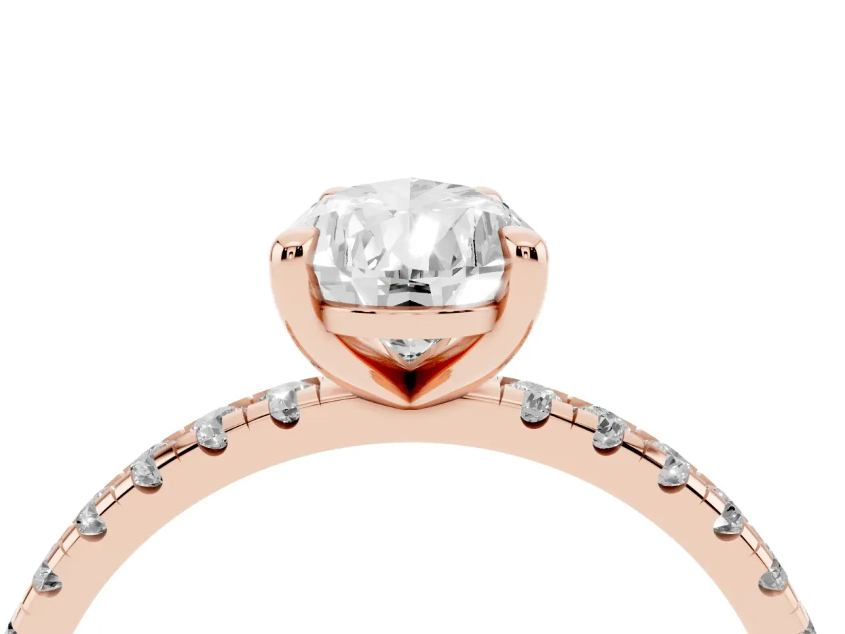 Pear Cut Diamond Brilliant Solitaire Ring with Pavé Band and Four-Prong Setting Rose gold