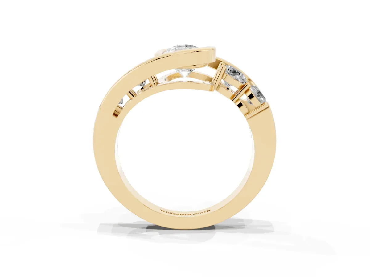 Bezel Set Pear Cut Diamond Bypass Ring with Round Accents Yellow gold