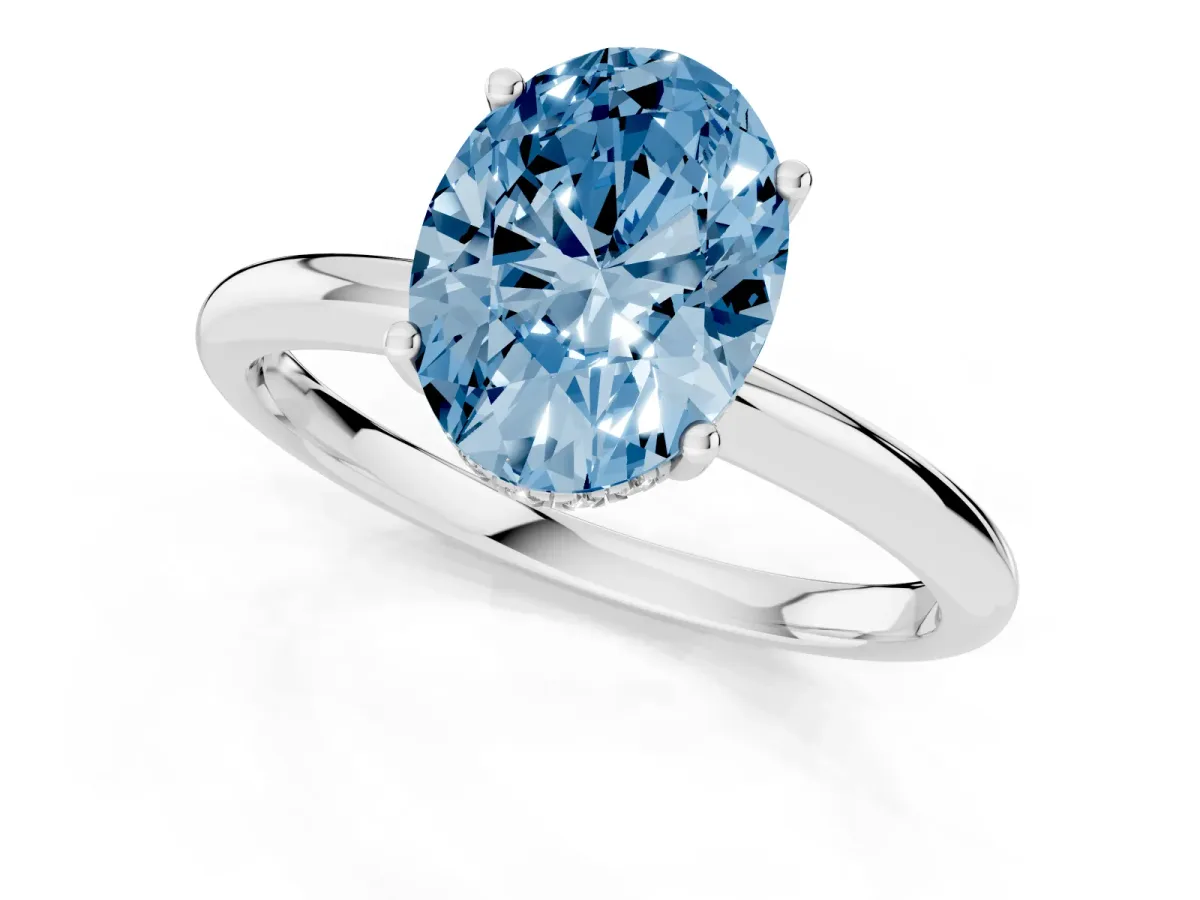 Fancy Blue Oval Cut Cut Solitaire Engagement Ring with Four-Prong Setting and Classic Band Silver