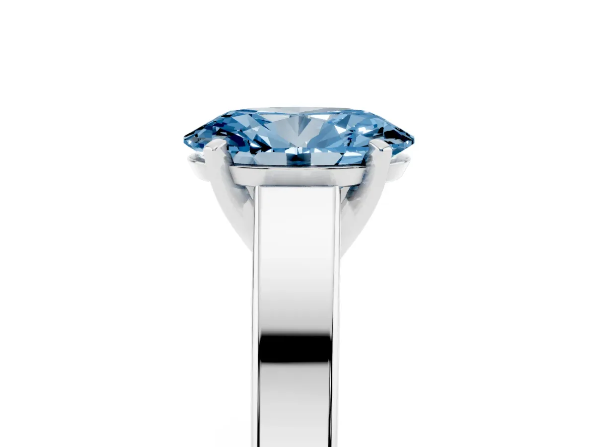 Fancy Blue Oval Cut Solitaire Engagement Ring with Four-Prong Setting and Tapered Band Silver