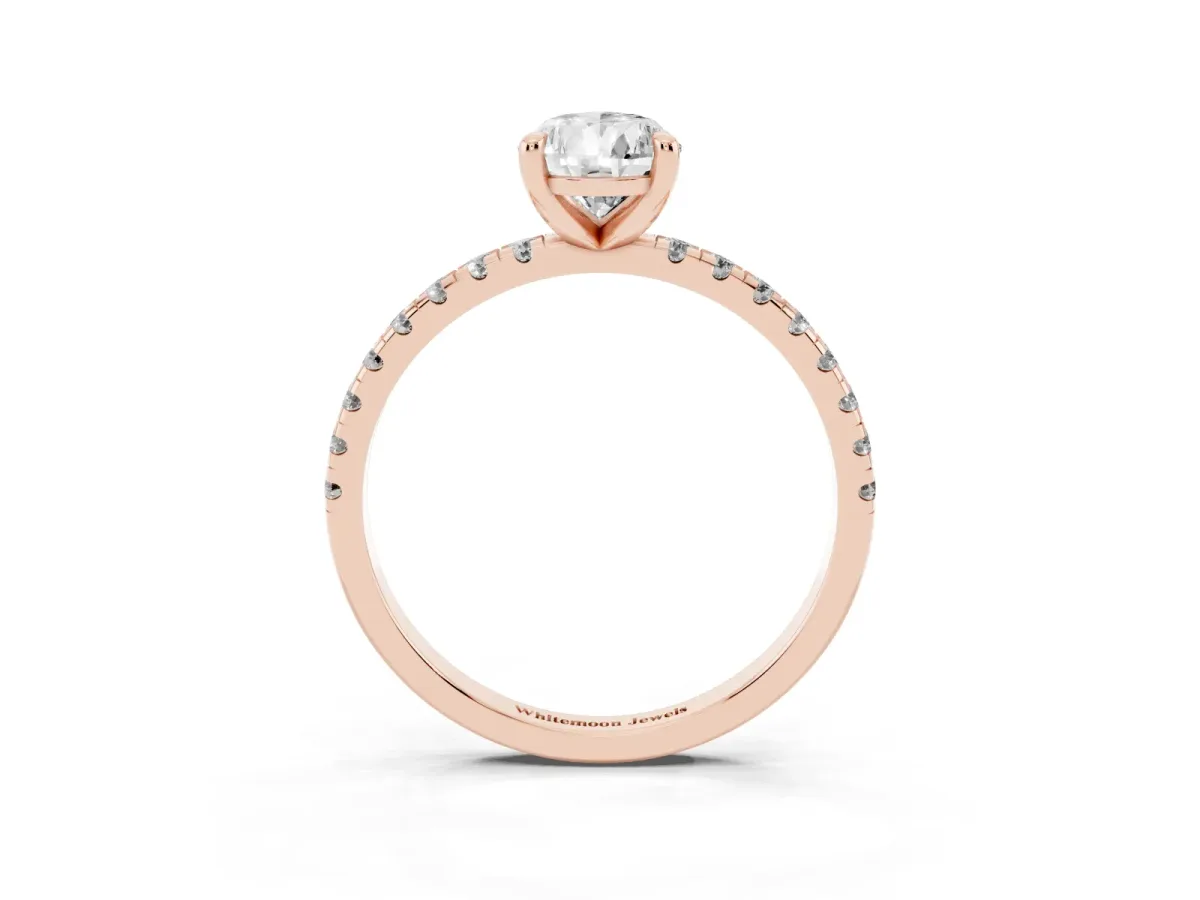 Pear Cut Diamond Brilliant Solitaire Ring with Pavé Band and Four-Prong Setting Rose gold