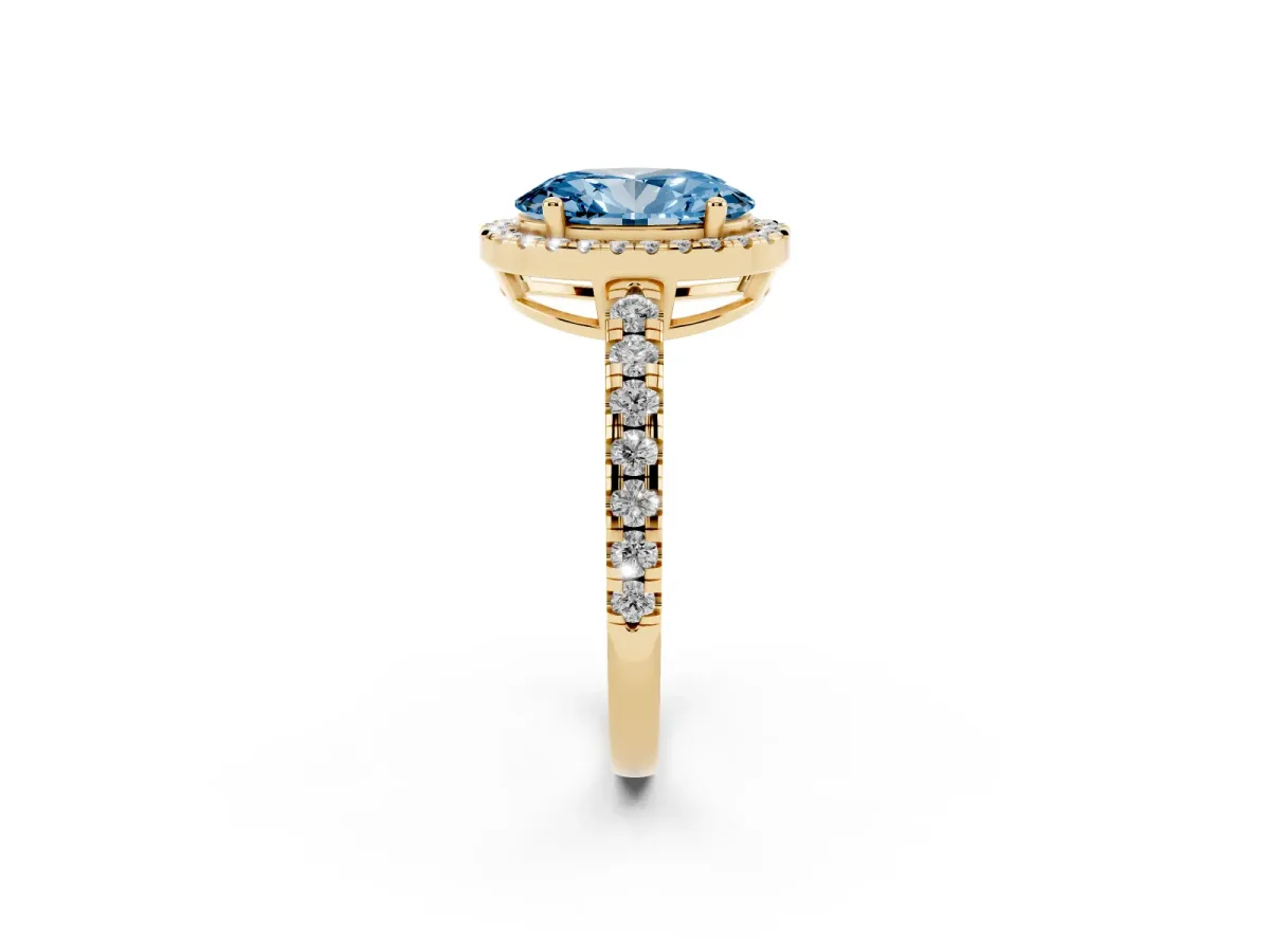 Fancy Blue Oval Cut Diamond Halo Ring with Pavé Band and Four-Prong Setting Yellow gold