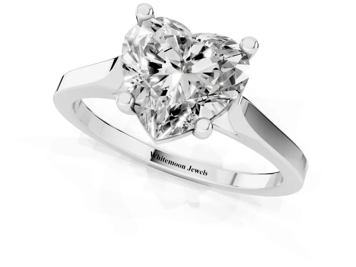Heart Cut Solitaire Diamond Ring with Four-Prong Setting and Tapered Band Silver