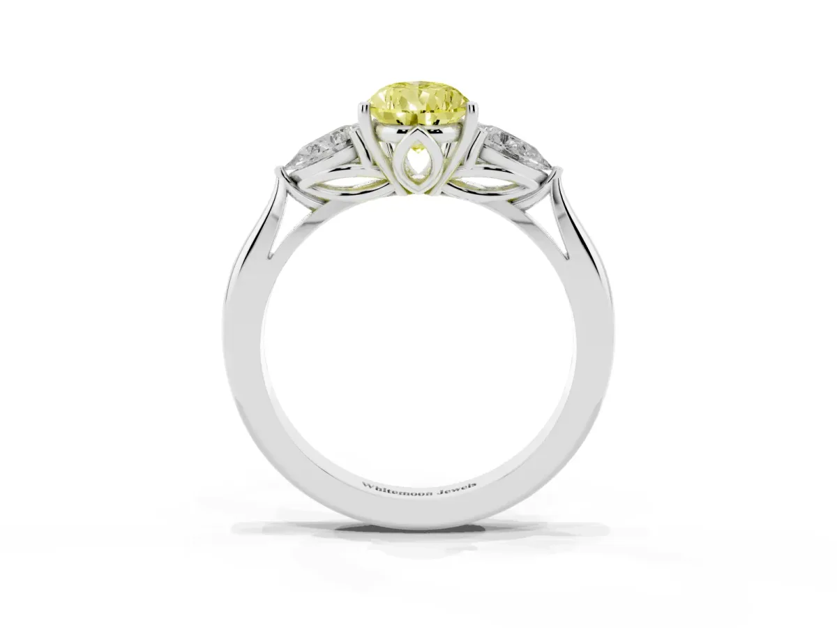 Fancy Yellow Three-Stone Pear Cut Brilliant Diamond Solitaire Ring with Tapered Band and Four-Prong Setting Platinum