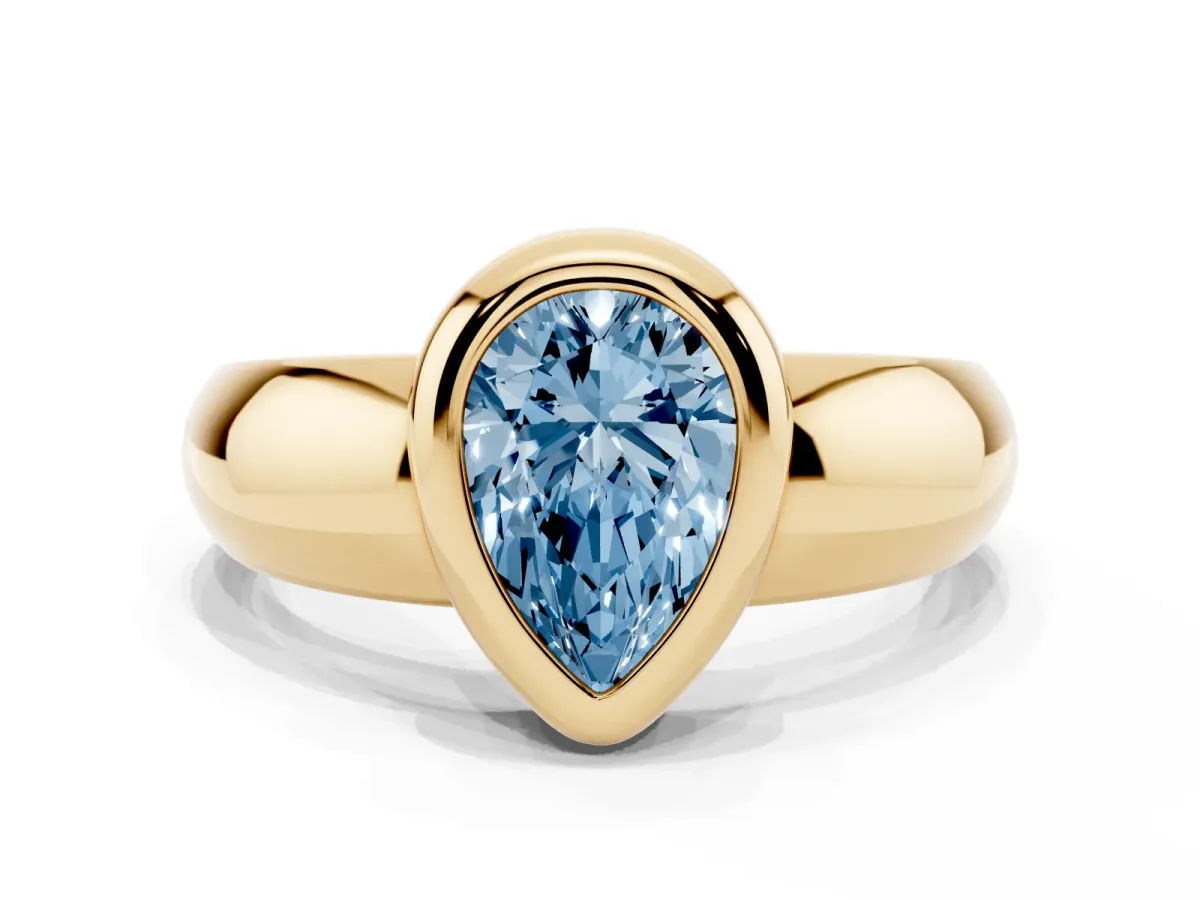 Fancy Blue Bezel Set Pear Cut Solitaire Ring with Wide Band Yellow gold