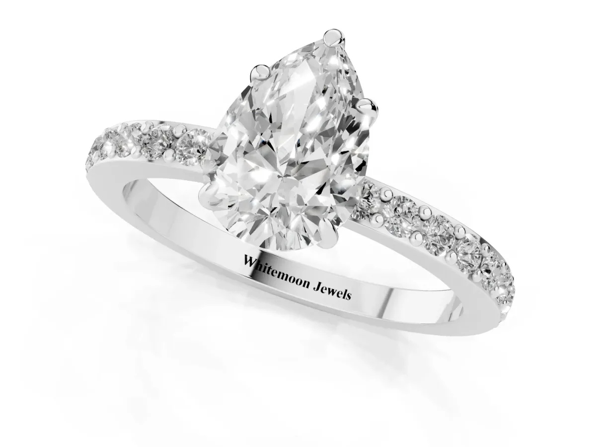 Pear Cut Diamond Pavé Engagement Ring with Round Accents and Prong Setting Platinum