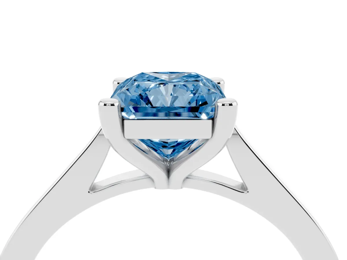 Fancy Blue Radiant Cut Solitaire Diamond Ring with Four-Prong Setting and Tapered Band Silver