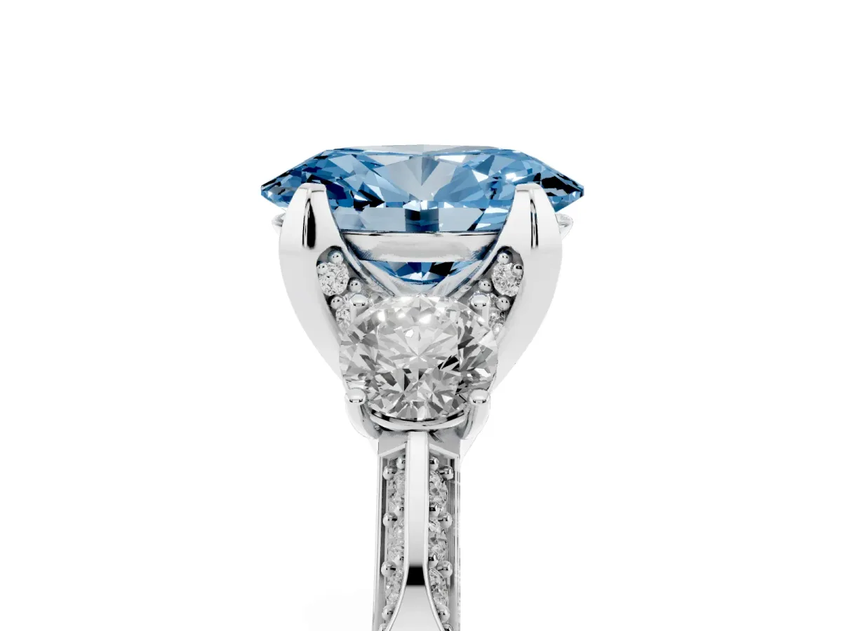 Fancy Blue Oval Cut Brilliant Three-Stone Diamond Ring with Pavé Band and Four-Prong Setting White gold