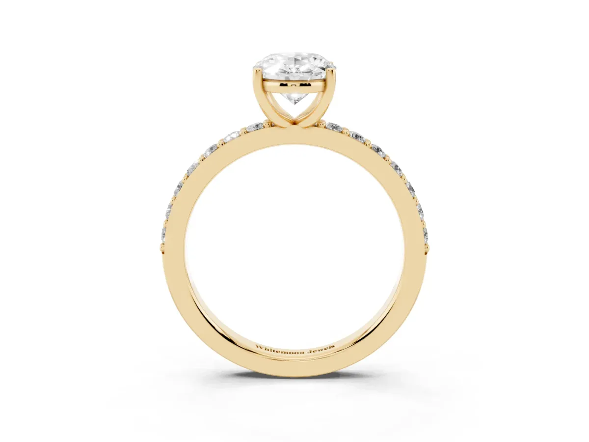 Oval Cut Cut Diamond Solitaire with Pave Band and Four-Prong Setting Yellow gold