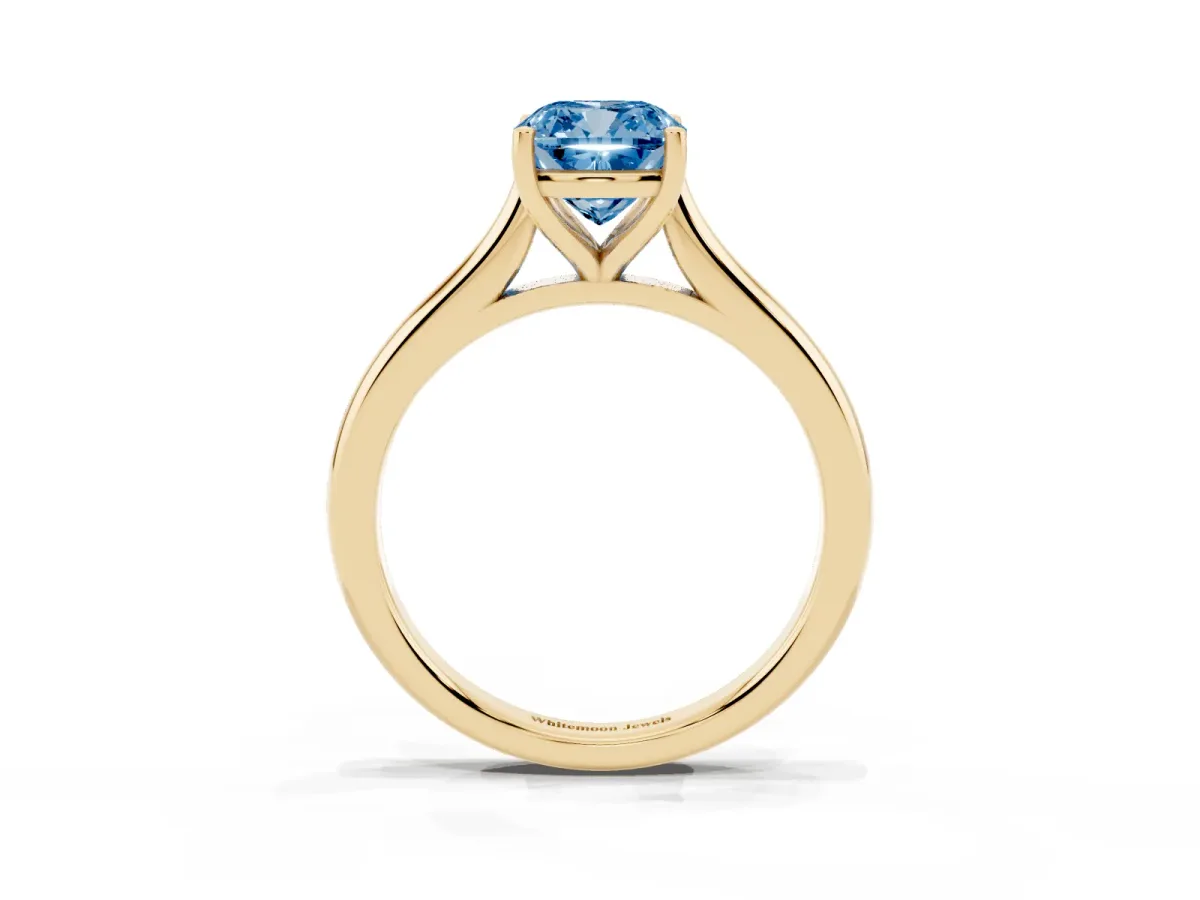 Fancy Blue Cushion Cut Cut Solitaire Ring with Cathedral Band and Four-Prong Setting Yellow gold