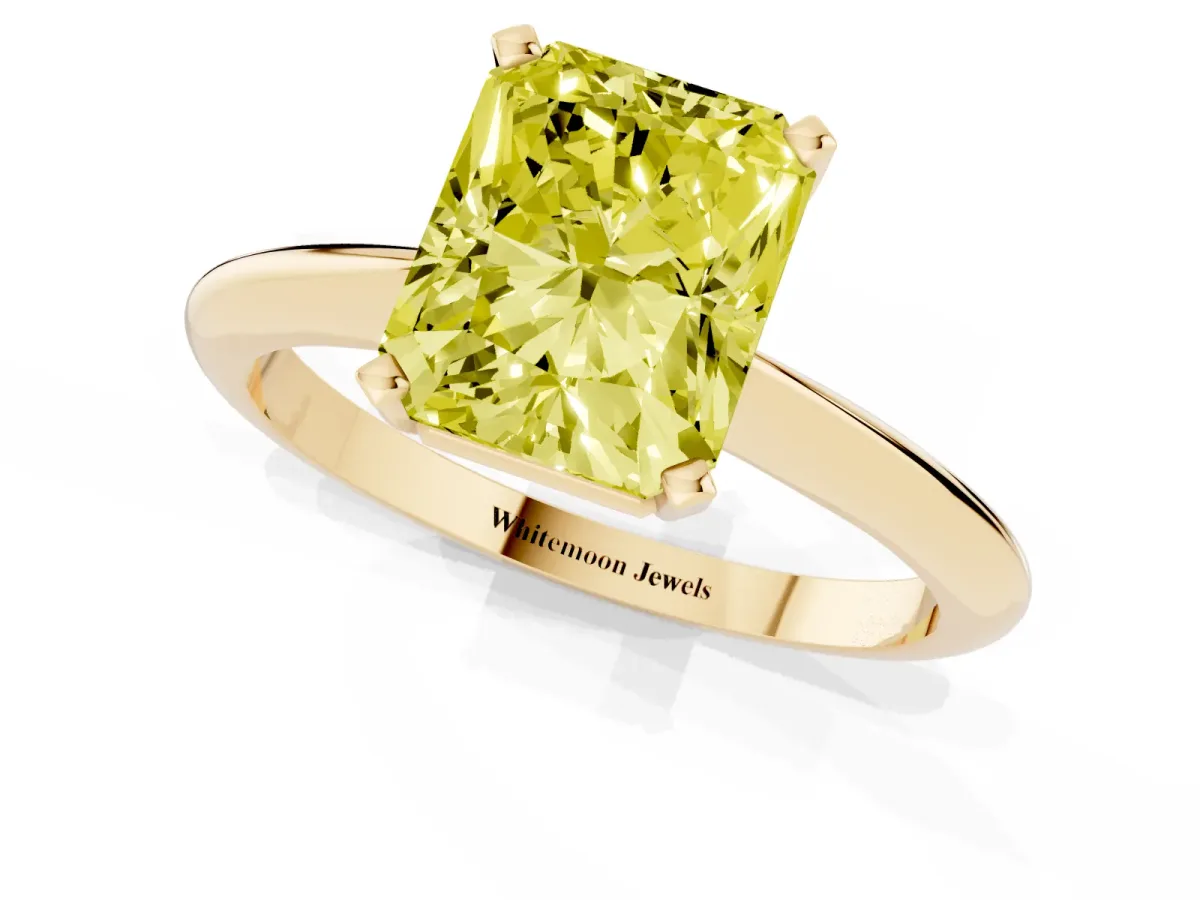 Fancy Yellow Radiant Cut Cut Solitaire Ring with Four-Prong Setting on a Classic Band Yellow gold
