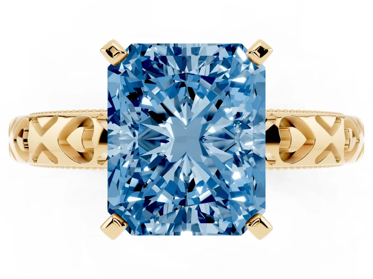 Fancy Blue Radiant Cut Solitaire Diamond Engagement Ring with XO Engraved Band and Four-Prong Setting Yellow gold