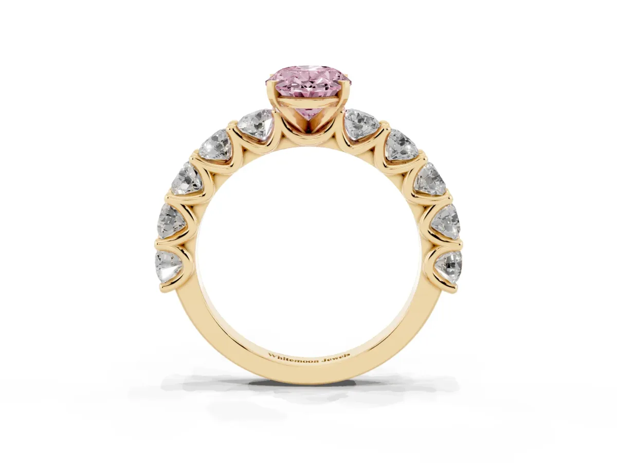 Fancy Pink Oval Cut Diamond Prong Setting with Side Stones on a Pave Band Yellow gold
