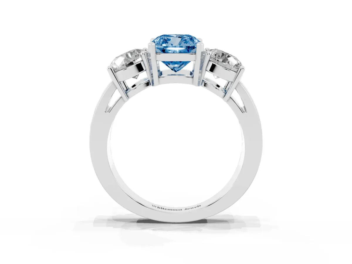 Fancy Blue Three-Stone Cushion Cut Diamond Ring with Round Side Stones, Classic Band, and Four-Prong Setting White gold
