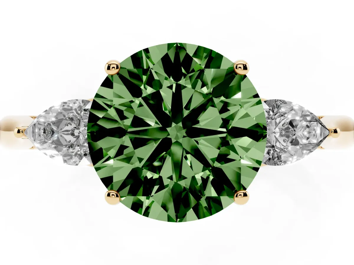 Fancy Green Three-Stone Round Cut Diamond Ring with Pear Side Stones in Four-Prong Setting Yellow gold
