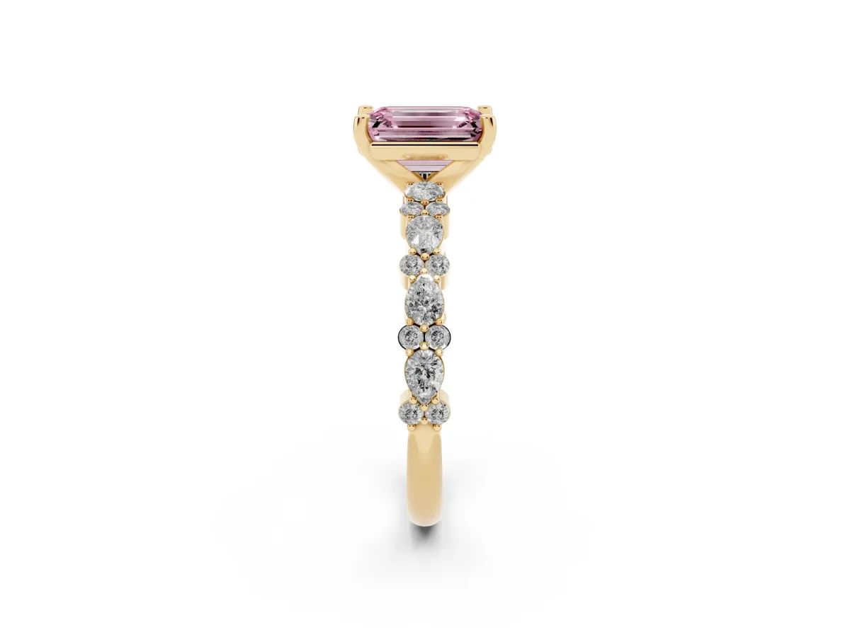 Fancy Pink Emerald Cut Diamond Side Stone Solitaire Ring with Round and Four-Prong Setting Yellow gold