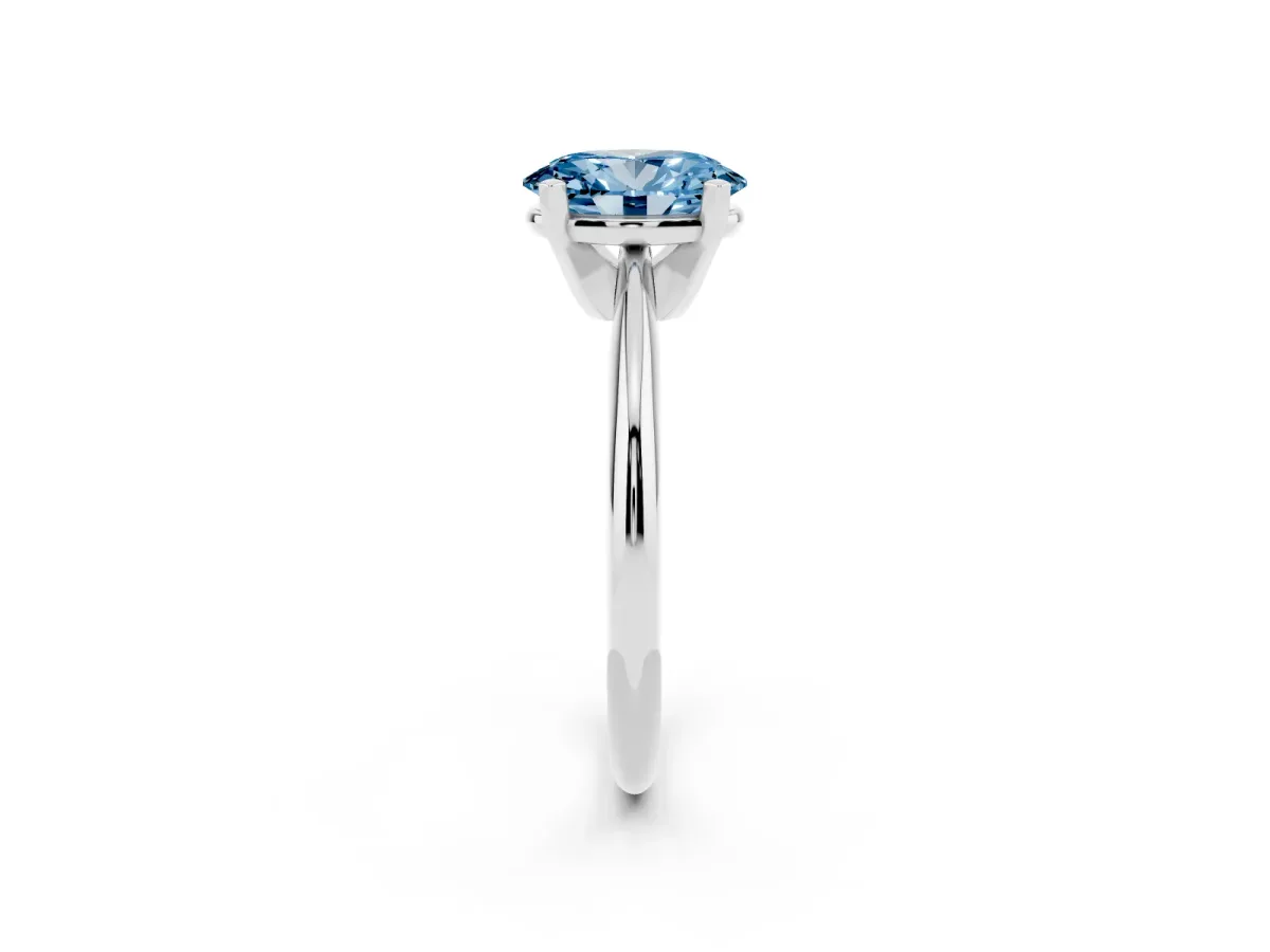 Fancy Blue Oval Cut Cut Solitaire Ring with Four-Prong Setting on a Classic Band Silver
