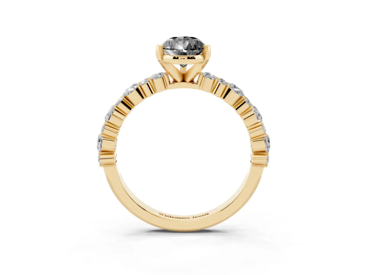 Fancy Black Pear Cut Diamond Side Stone Solitaire Ring with Round and Four-Prong Setting Yellow gold