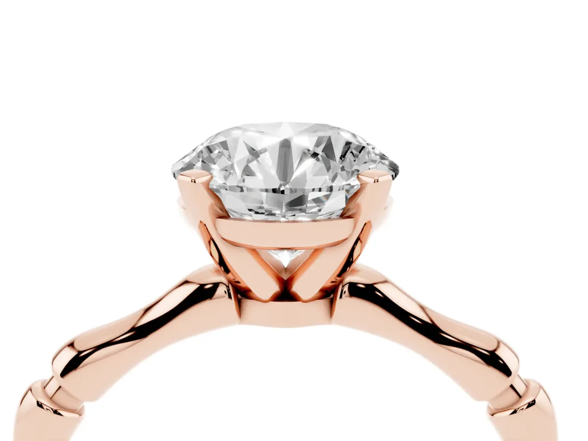 Round Cut Solitaire Diamond Ring with Bamboo Band and Four-Prong Setting Rose gold