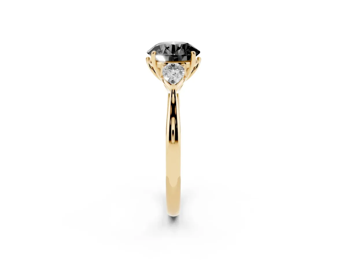 Fancy Black Round Cut Diamond Three-Stone Ring with Pear Side Stones and Prong Setting Yellow gold