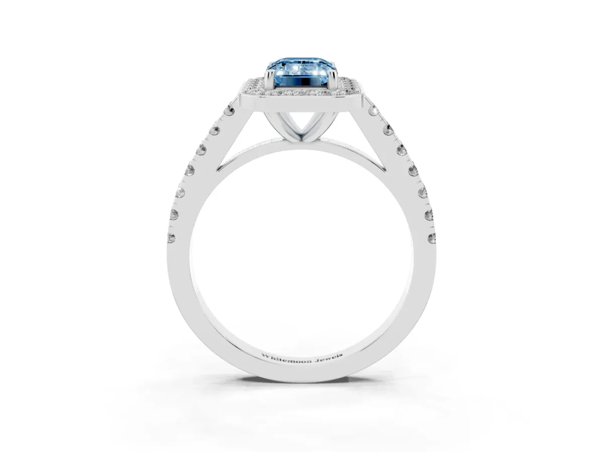 Fancy Blue Emerald Cut Diamond Halo Ring with Round Pavé Split Shank and Prong Setting Platinum