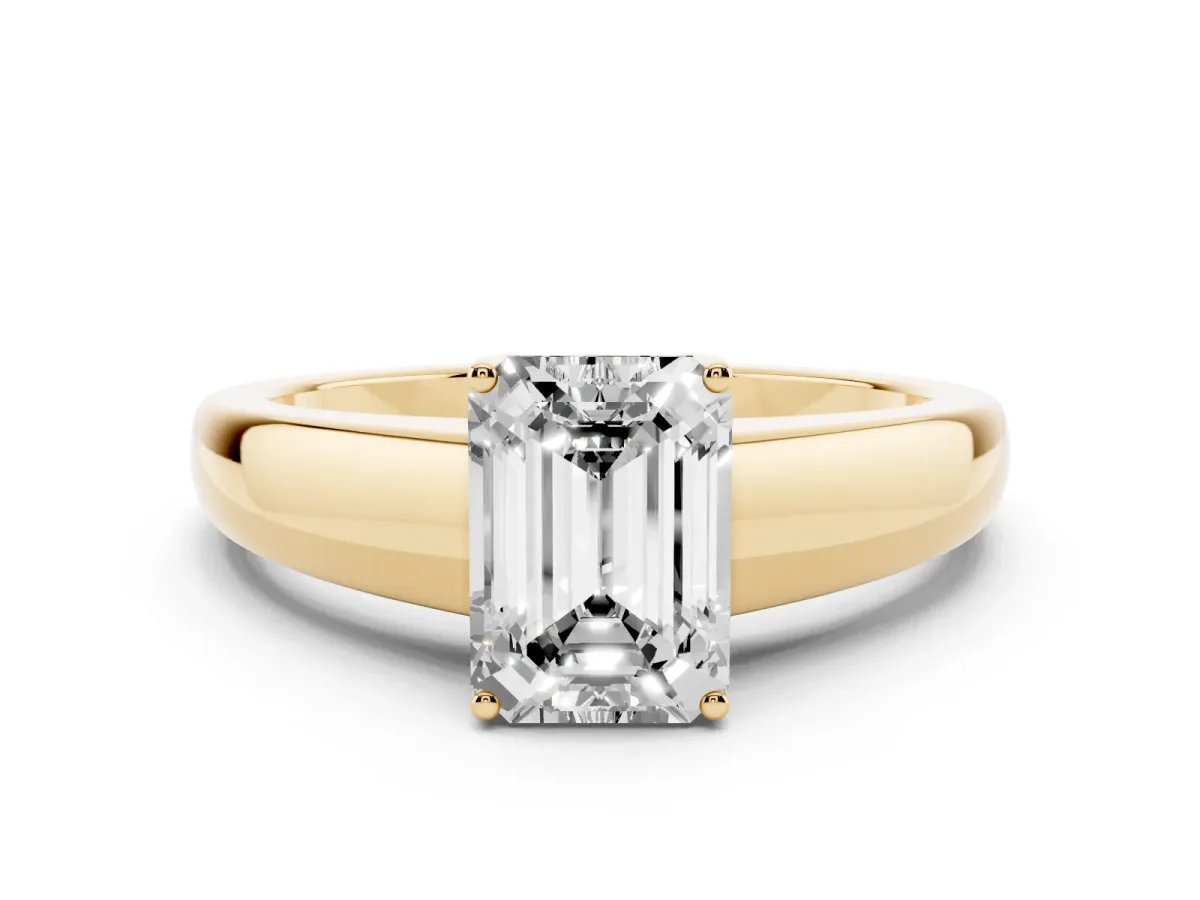 Emerald Cut Solitaire Diamond Ring with Tapered Band and Four-Prong Setting Yellow gold