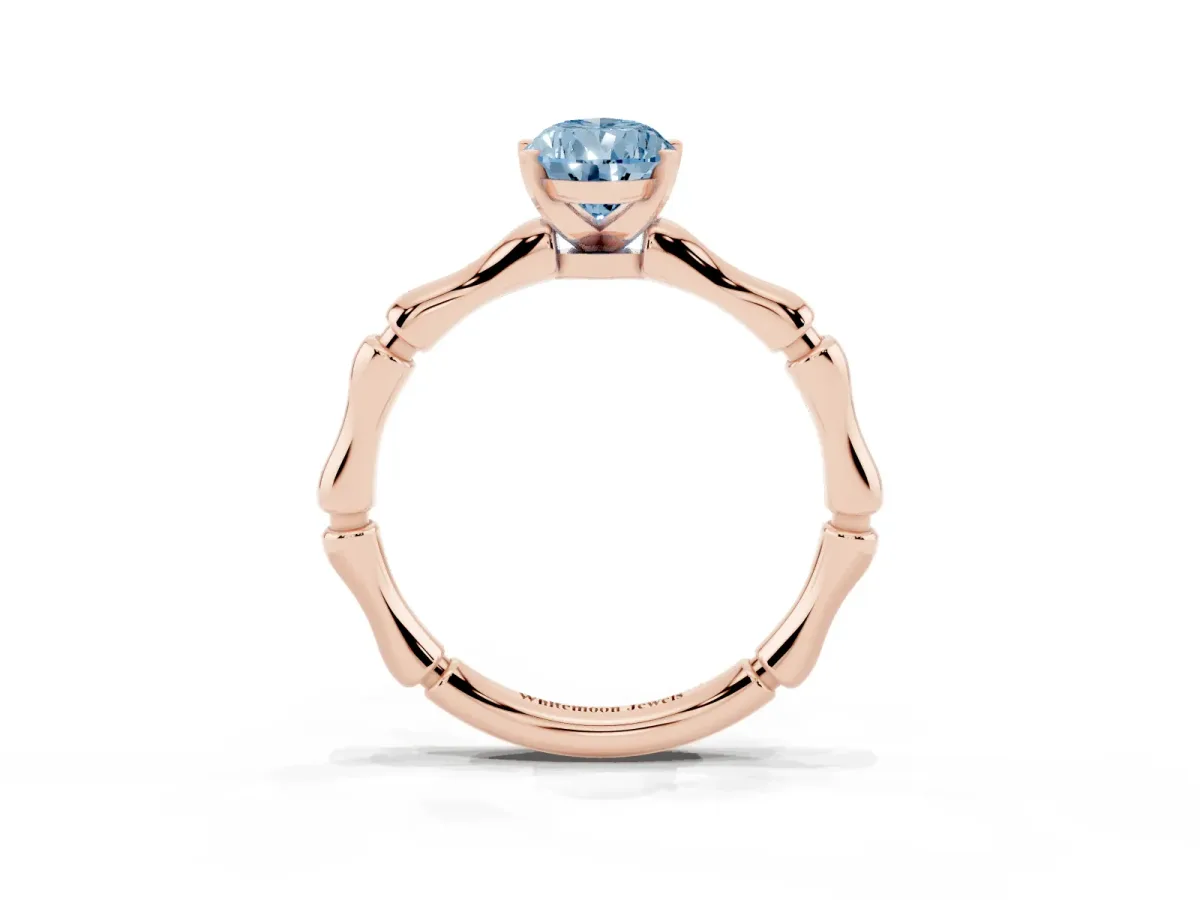 Fancy Blue Pear Cut Solitaire Diamond Ring with Bamboo Band and Four-Prong Setting Rose gold