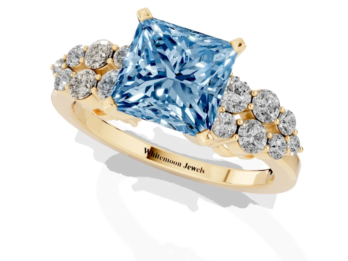 Fancy Blue Princess Cut Cluster Diamond Engagement Ring with Pavé Band and Four-Prong Setting Yellow gold