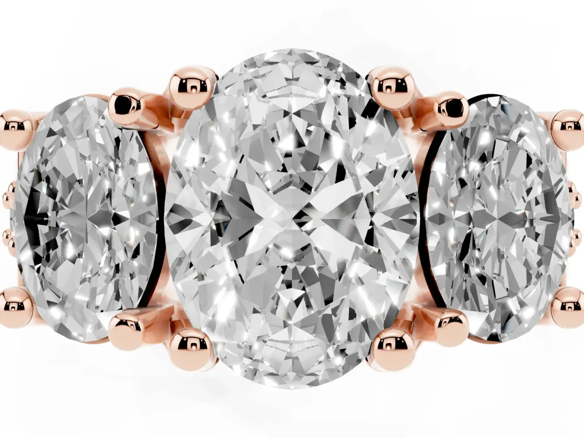 Oval Cut Diamond Three-Stone Ring with Channel Set Band and Four-Prong Setting Rose gold
