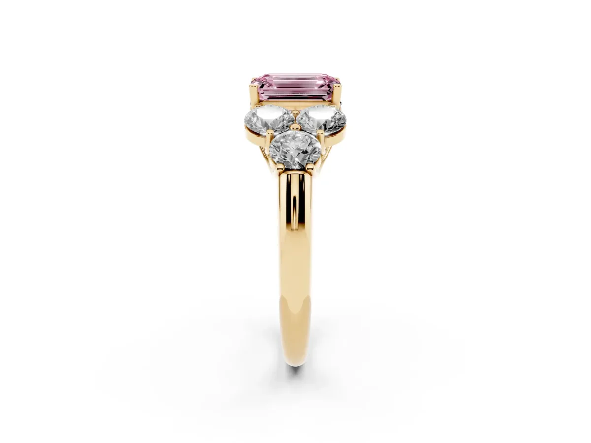 Fancy Pink Emerald Cut Cut Diamond Cluster Ring with Round Accent Stones and Prong Setting on a Classic Band Yellow gold