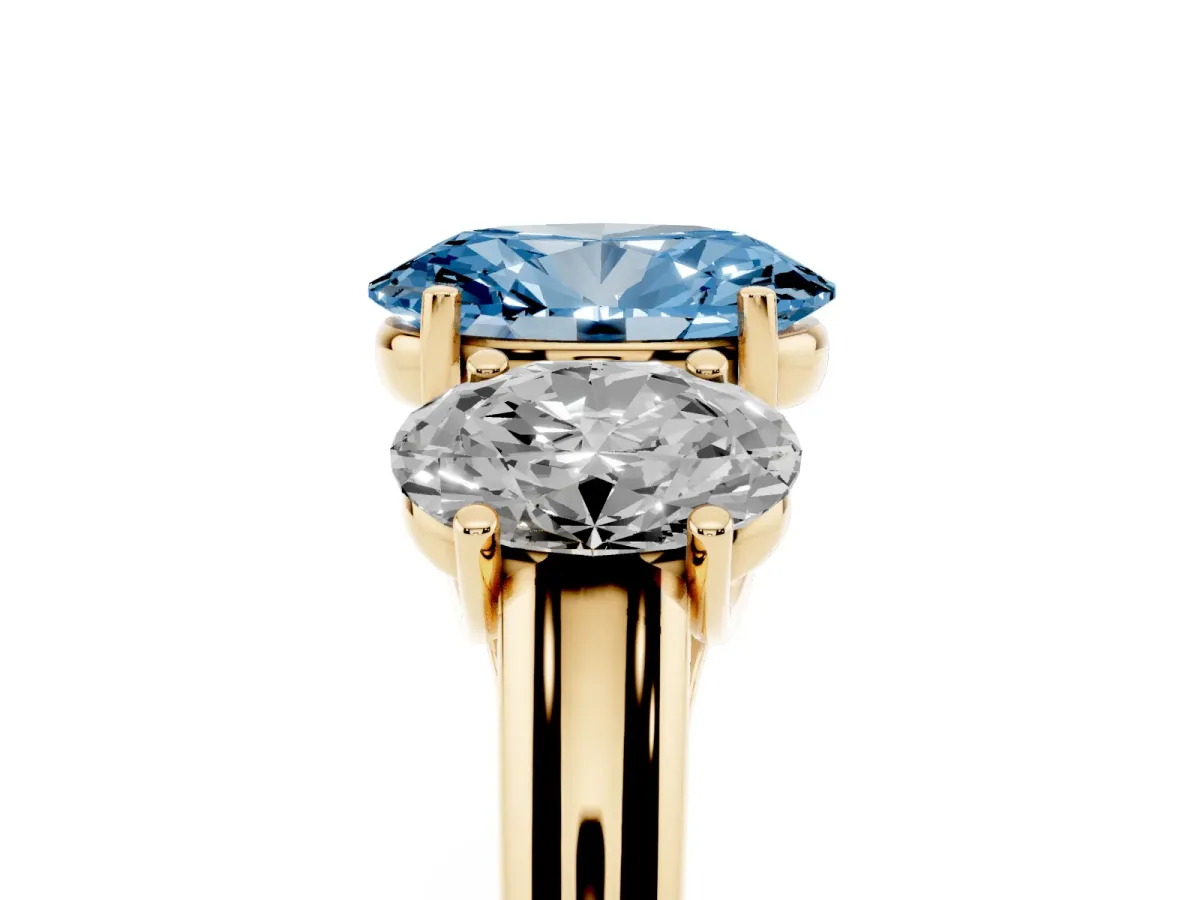 Fancy Blue Three-Stone Oval Cut Diamond Engagement Ring with Prong Setting Yellow gold