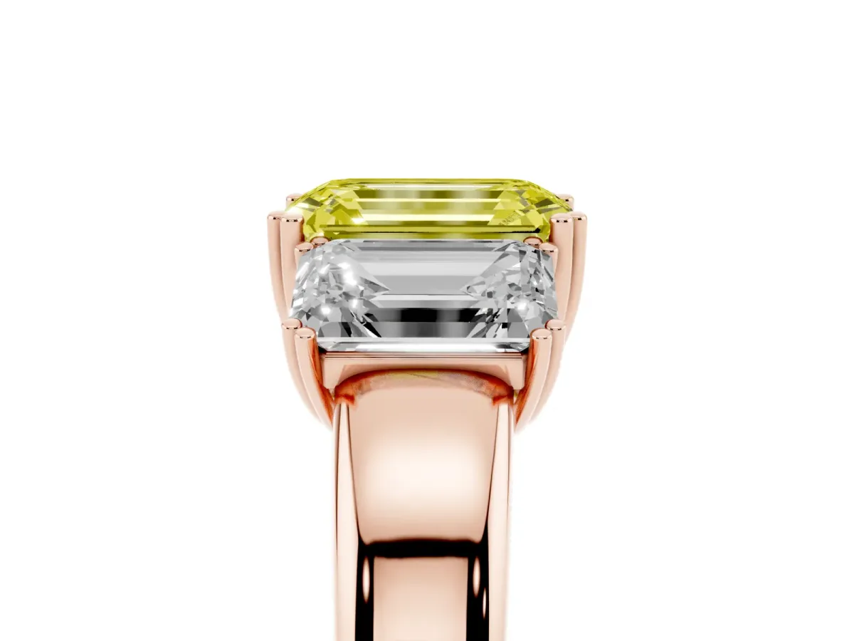 Fancy Yellow Three-Stone Emerald Cut Cut Diamond Ring with Channel Set Band and Four-Prong Setting Rose gold