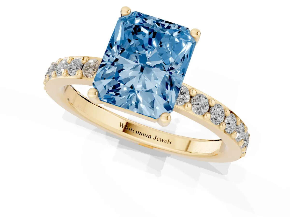 Fancy Blue Radiant Cut Cut Diamond Solitaire with Pave Band and Four-Prong Setting Yellow gold