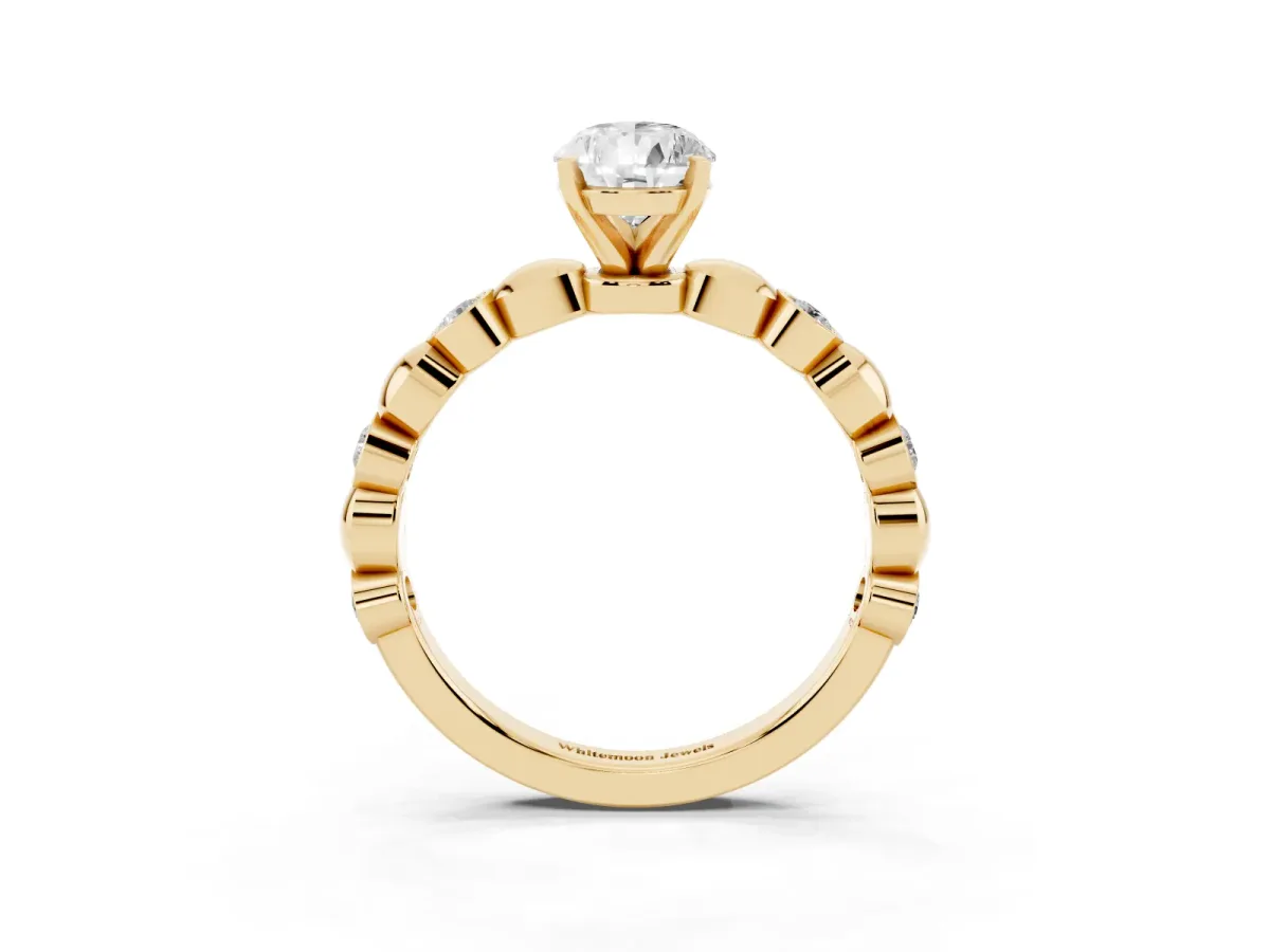 Pear Cut Solitaire Bezel-Set Diamond Ring with Beaded Band and Four-Prong Setting Yellow gold