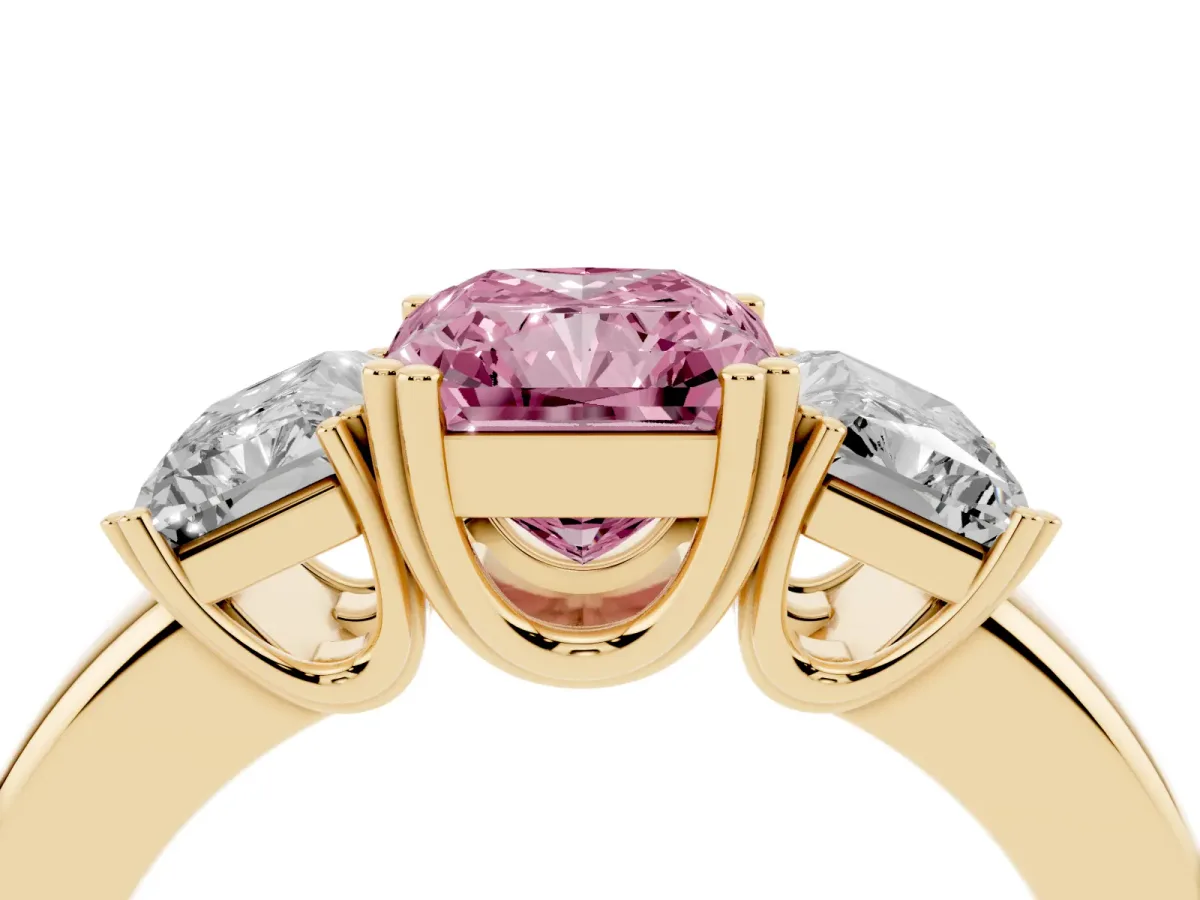 Fancy Pink Three-Stone Radiant Cut Cut Diamond Ring with Channel Set Band and Four-Prong Setting Yellow gold