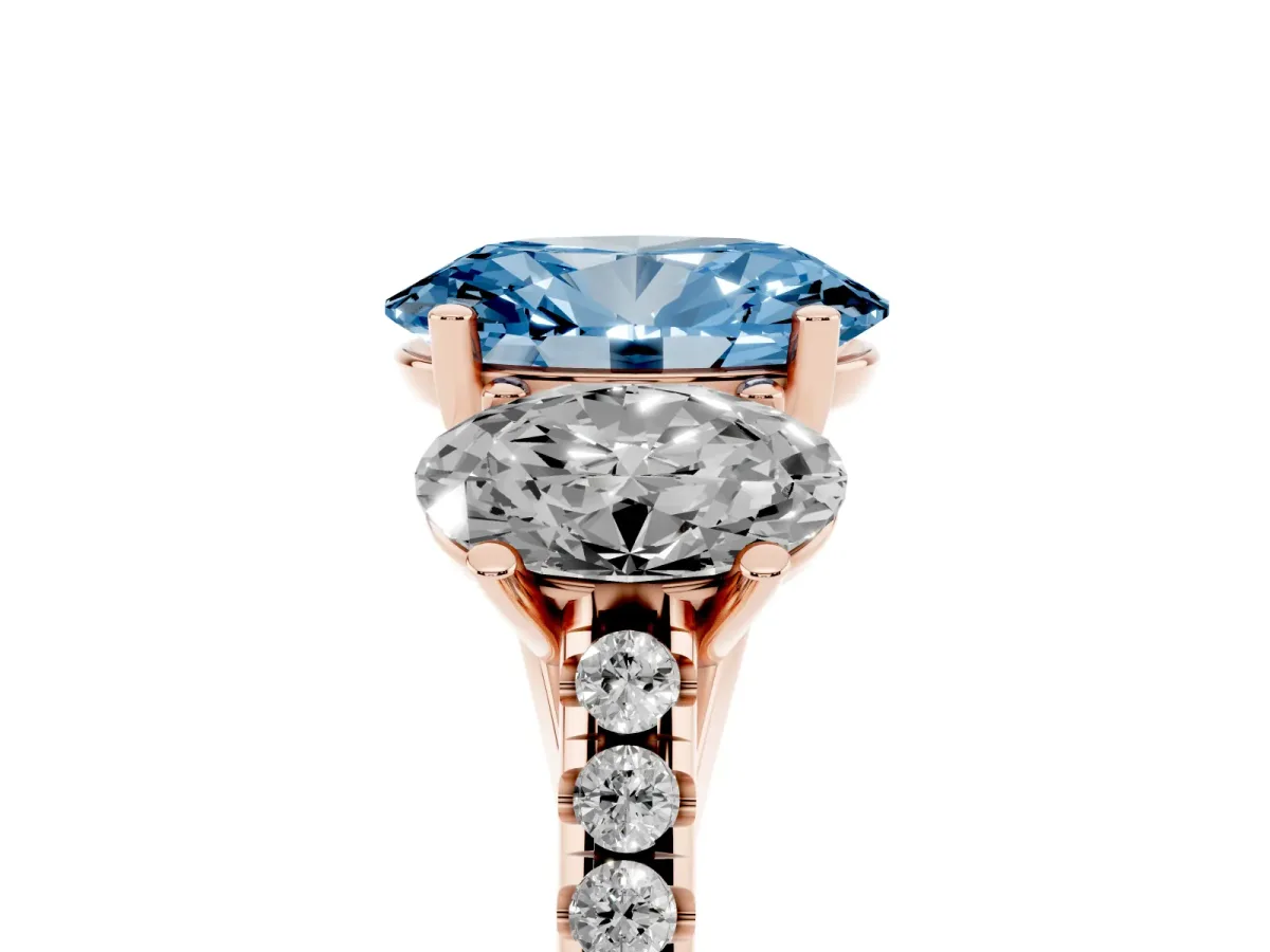 Fancy Blue Three-Stone Oval Cut Diamond Ring with Round Pavé Band and Prong Setting Rose gold