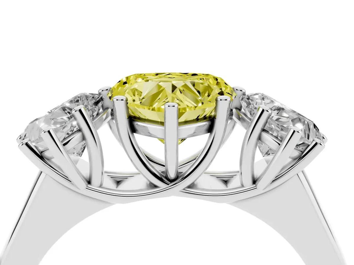 Fancy Yellow Heart Cut Three-Stone Diamond Ring with Prong Setting on a Classic Band Silver