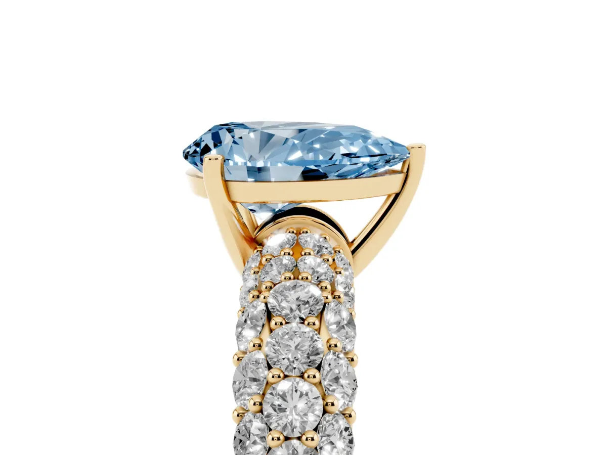 Fancy Blue Pear Cut Diamond Pavé Band Solitaire Ring with Four-Prong Setting Yellow gold