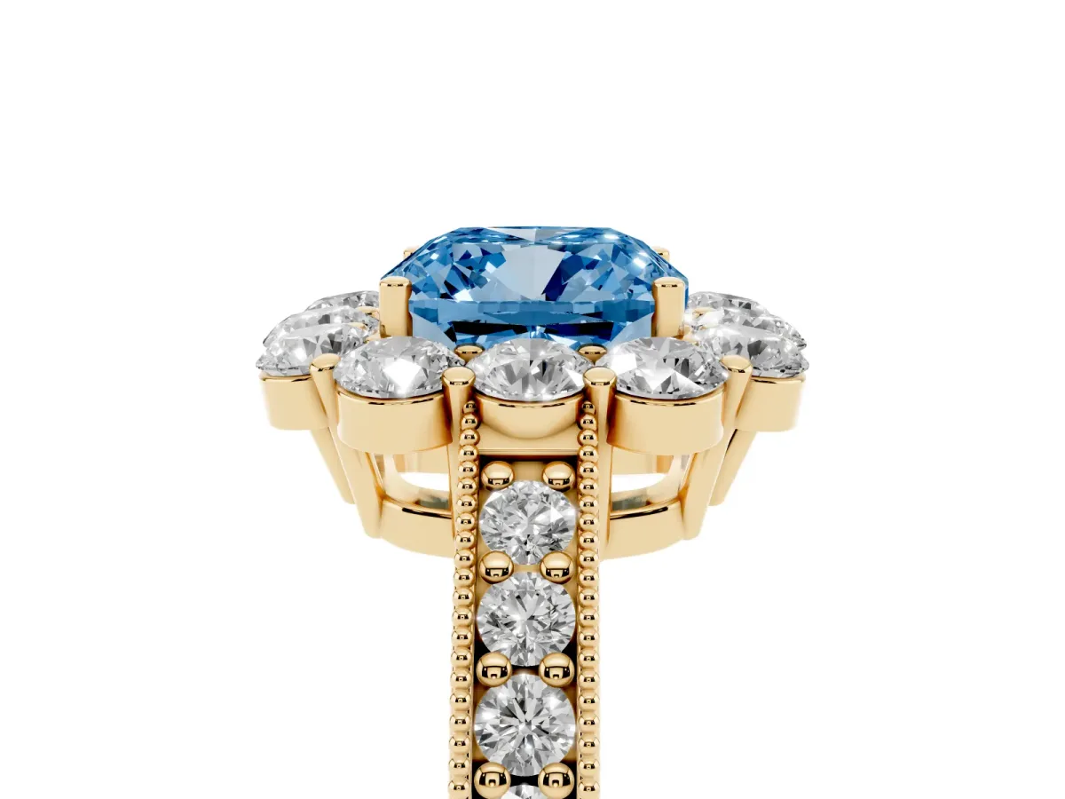 Fancy Blue Cushion Cut Cut Halo Diamond Pavé Engagement Ring with Milgrain Detailing Yellow gold