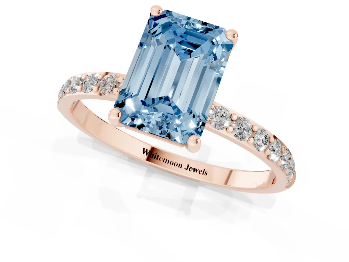 Fancy Blue Emerald Cut Diamond Solitaire Ring with Round Pavé Shoulders and Prong Setting Rose gold