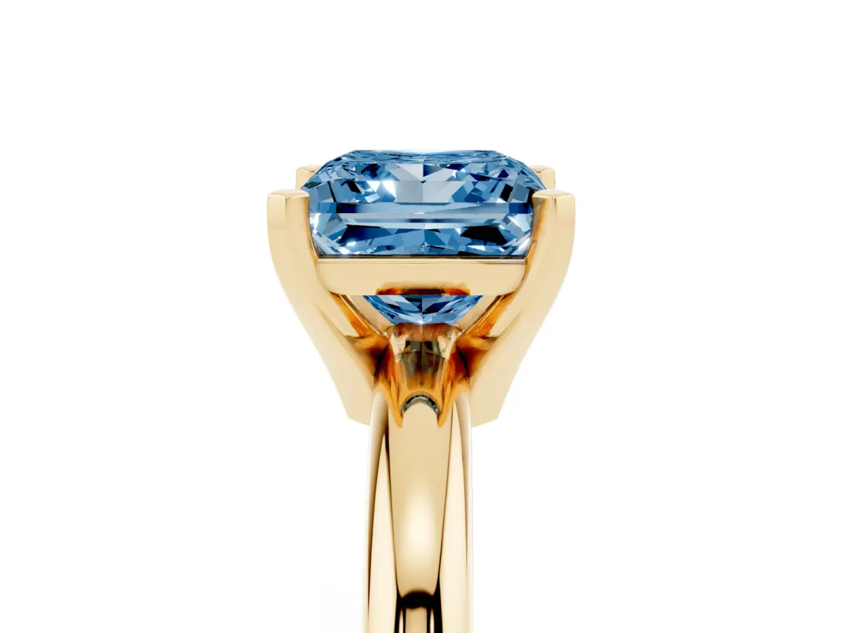 Fancy Blue Princess Cut Diamond Solitaire Engagement Ring with Round Band and Four-Prong Setting Yellow gold