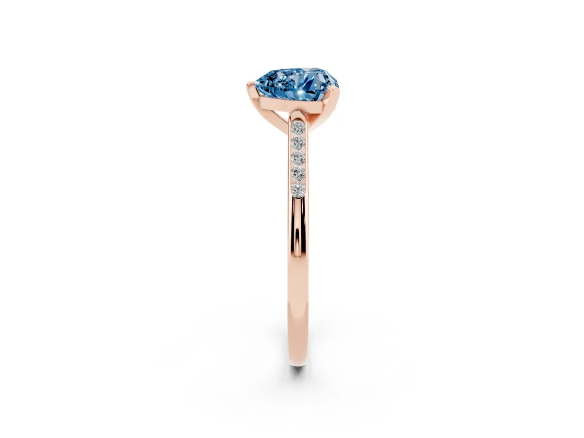 Fancy Blue Heart Cut Diamond Solitaire Ring with Channel Set Round Band and Prong Setting Rose gold