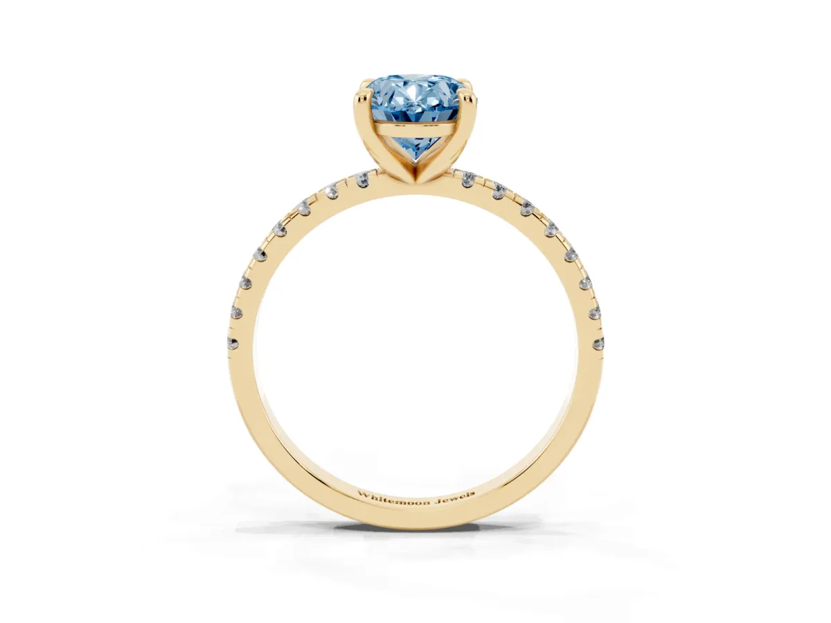 Fancy Blue Oval Cut Diamond Brilliant Solitaire Ring with Pavé Band and Four-Prong Setting Yellow gold