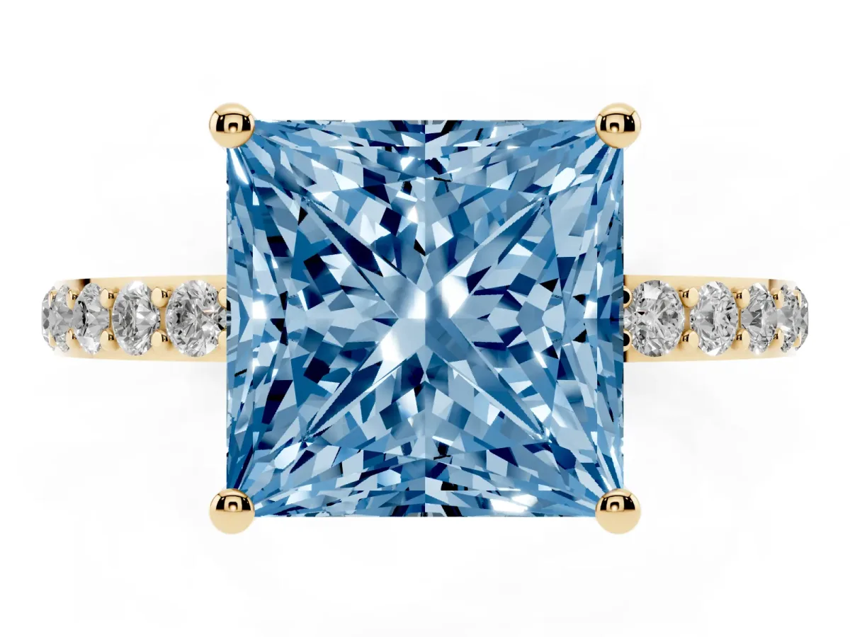 Fancy Blue Princess Cut Diamond Solitaire Ring with Round Pavé Shoulders and Prong Setting Yellow gold