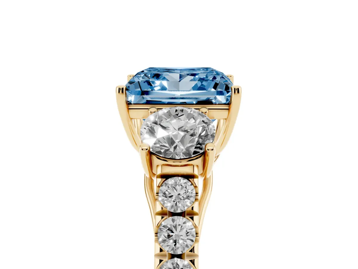 Fancy Blue Princess Cut Cut Diamond Three-Stone Ring with Round Side Stones and Pavé Band Yellow gold