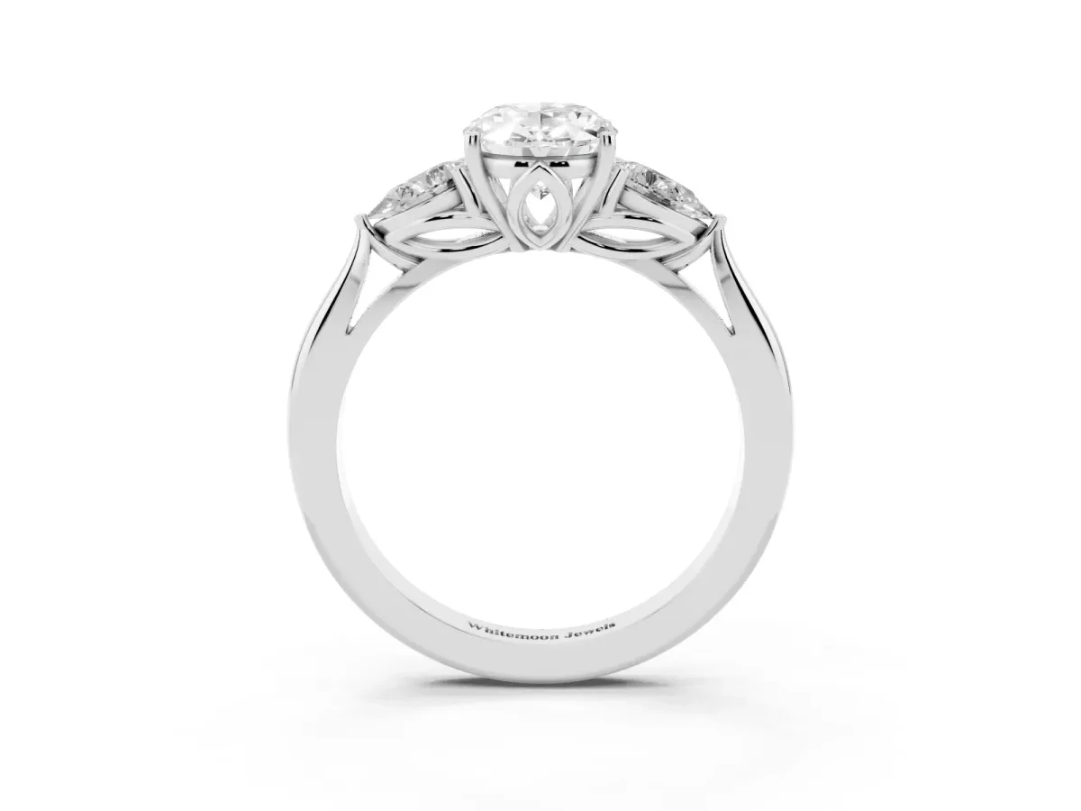 Three-Stone Oval Cut Diamond Ring with Pear Side Stones in Four-Prong Setting Platinum