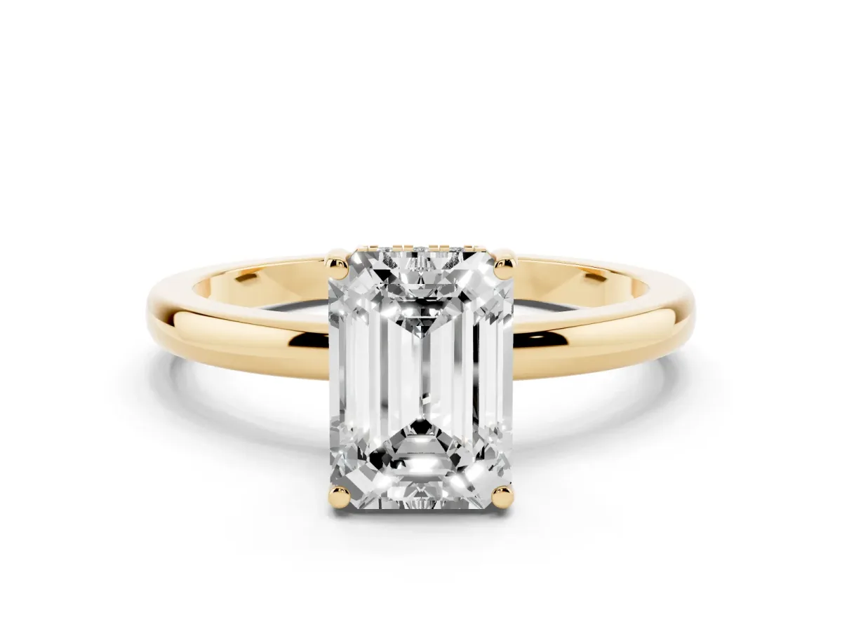 Emerald Cut Solitaire Diamond Ring with Prong Setting and Plain Band Yellow gold