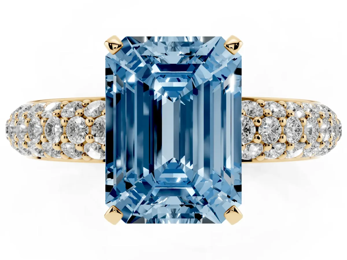Fancy Blue Emerald Cut Diamond Solitaire Ring with Prong Setting and Pavé Band Yellow gold