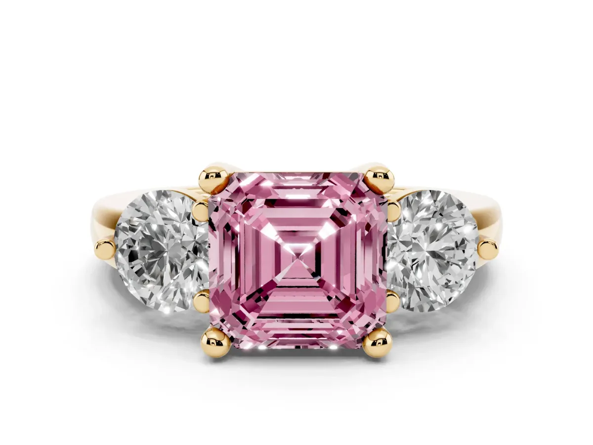 Fancy Pink Three-Stone Asscher Cut Brilliant Cut Solitaire Ring with Prong Setting on a Classic Band Yellow gold