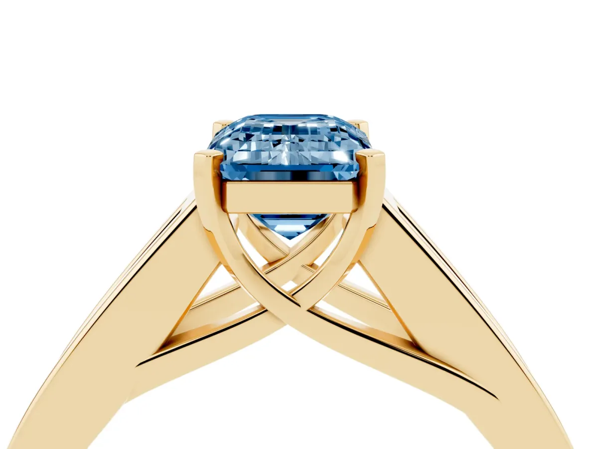 Fancy Blue Emerald Cut Cut Channel Set Solitaire Ring with Four-Prong Setting Yellow gold
